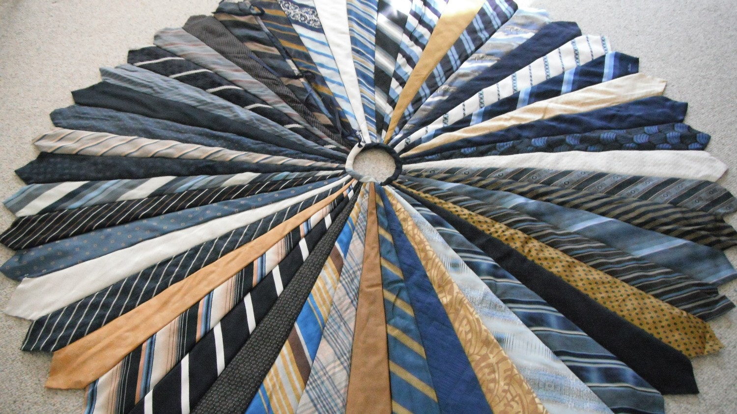 Christmas Tree Skirt It is made of 48 mens ties, mostly blues and yellows. Christmas tree