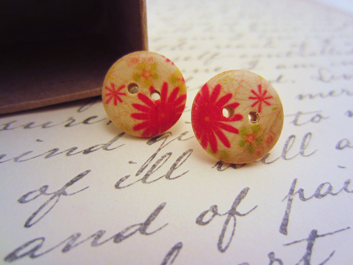 Red post earrings. Wooden buttons. Silver posts. Stud earrings. Tan brown, red flowers, pale green.