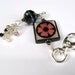 Square Funky Bone With Pink Flower Purse Charm