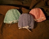 Set of three Newborn Baby Girl Crocheted Caps With Ribbons pink, lilac, and mint green