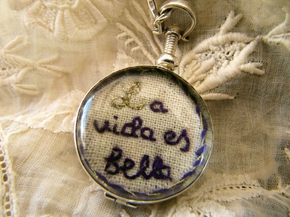 Hand Embroidered  Art Piece in a Two Sided Glass Locket , Sterling Silver Mounted Pendant