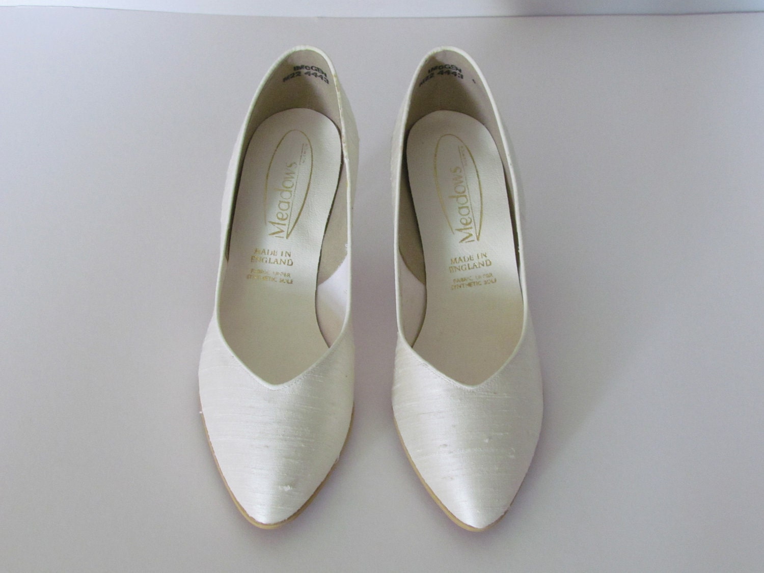 white flat court shoes