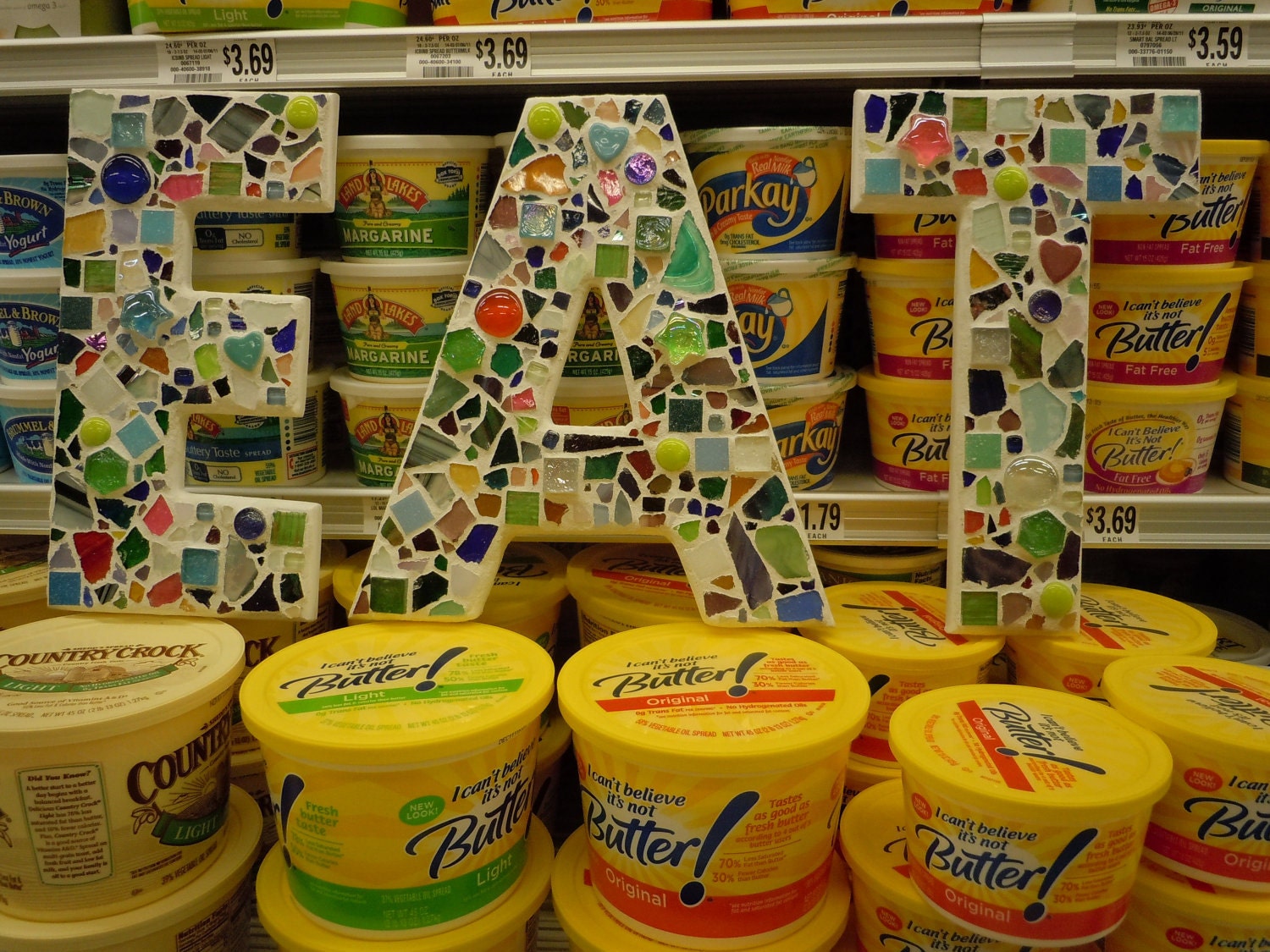 Large Mosaic Letters Encouraging You To EAT . . . . E A T