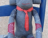 Red and gray argyle office sock monkey