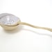 Beautiful tea strainer  with curled grip with a fitting bowl