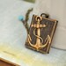 JOURNEY book style antiqued brass locket with anchor