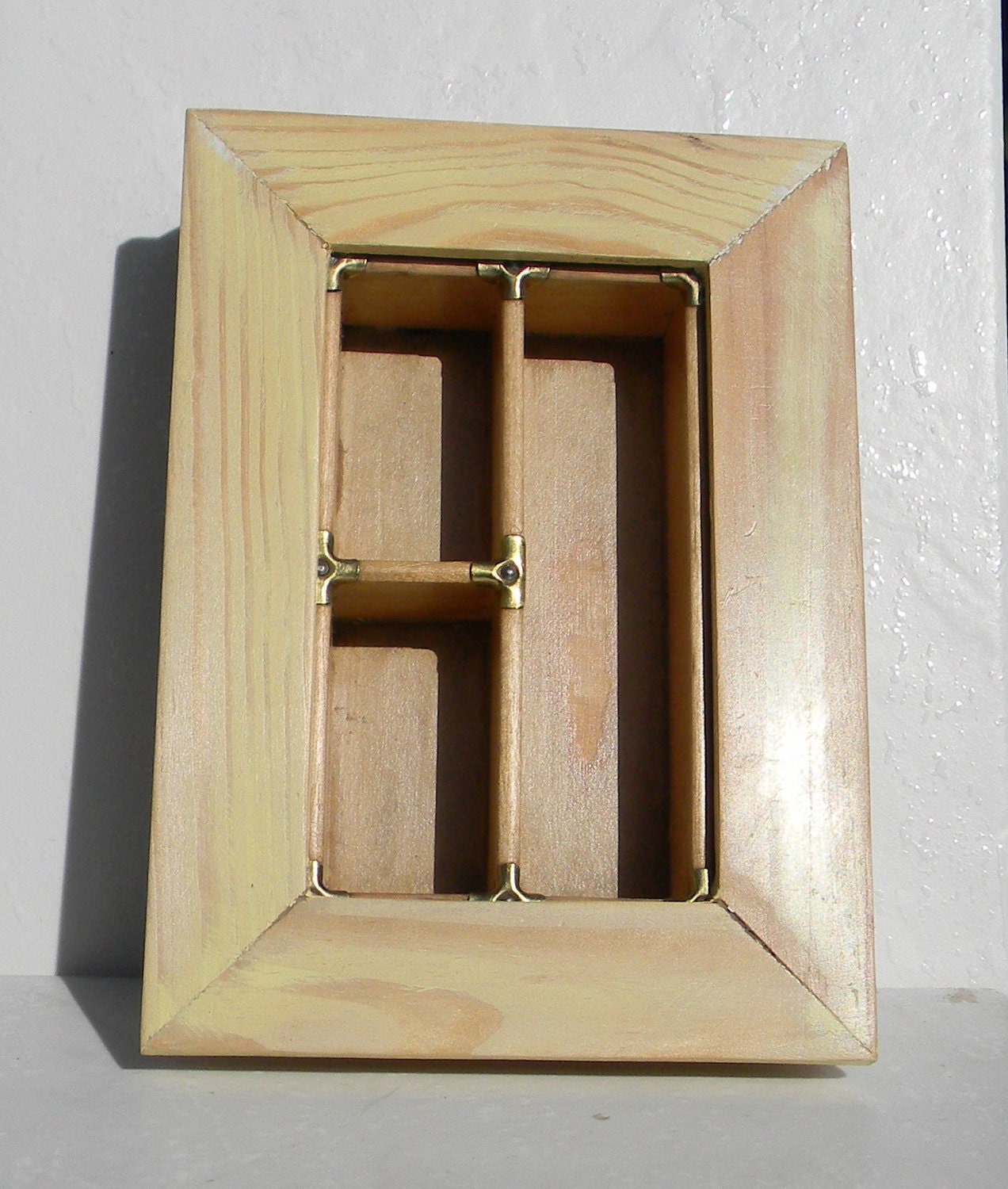 Part printer's type case in a frame, display thimbles, etc.