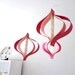 Valentines Day paper decorations, recycled romance novels, retro geometric curves, pink white
