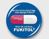 FUKITOL-EX, For When Life Just Blows. The little pink and white pill button badge