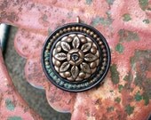 vintage button pendant necklace jewelry large gold metal flower bloom with leaves surrounded by patinaed brass beads and black black base