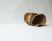 Asymmetrical cuff / bracelet from felt, vintage wool and feather.
