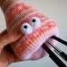 Orange, pink and yellow Fairisle alien desk worm