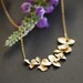 A girl who loves orchids . Gold filled chain