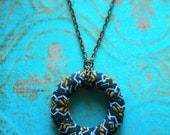 Long and Lovely Fabric Wrapped Necklace - Navy, blue, and orange pattern