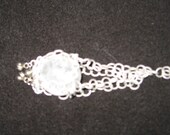 Clear Quartz Sphere in Acid Etched Aluminum Net with Tiny Bells