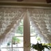 pair of romantic snow white ruffled curtains