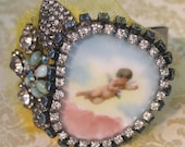 Assemblange Cuff Bracelet featuring Cherub on Porcelain and Loads of Vintage Rhinestones