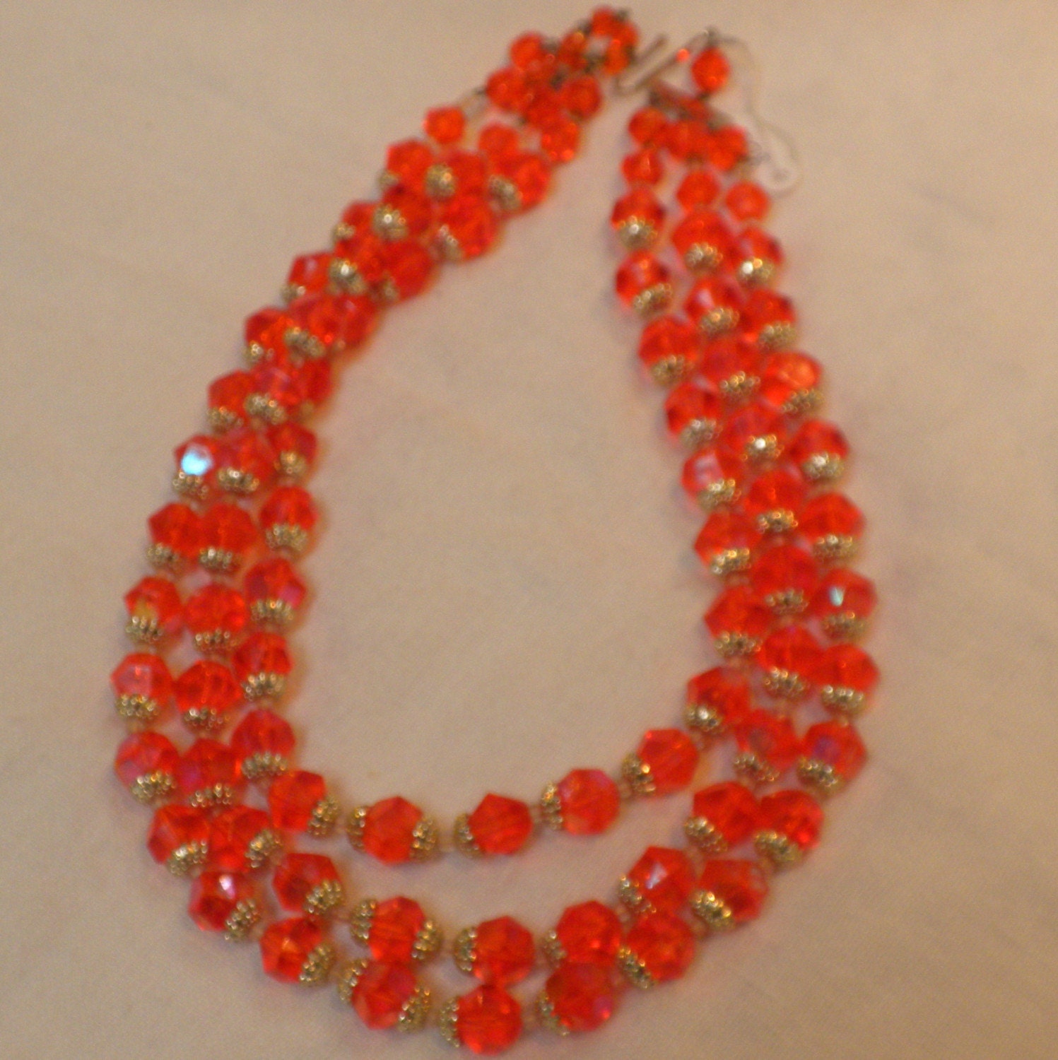 Orange Lucite Beaded Necklace with Goldtone Filligree Caps and Earrings on Sale