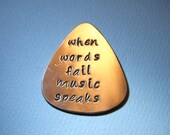 Copper Guitar Pick Handmade and Stamped with When Words Fail Music Speaks