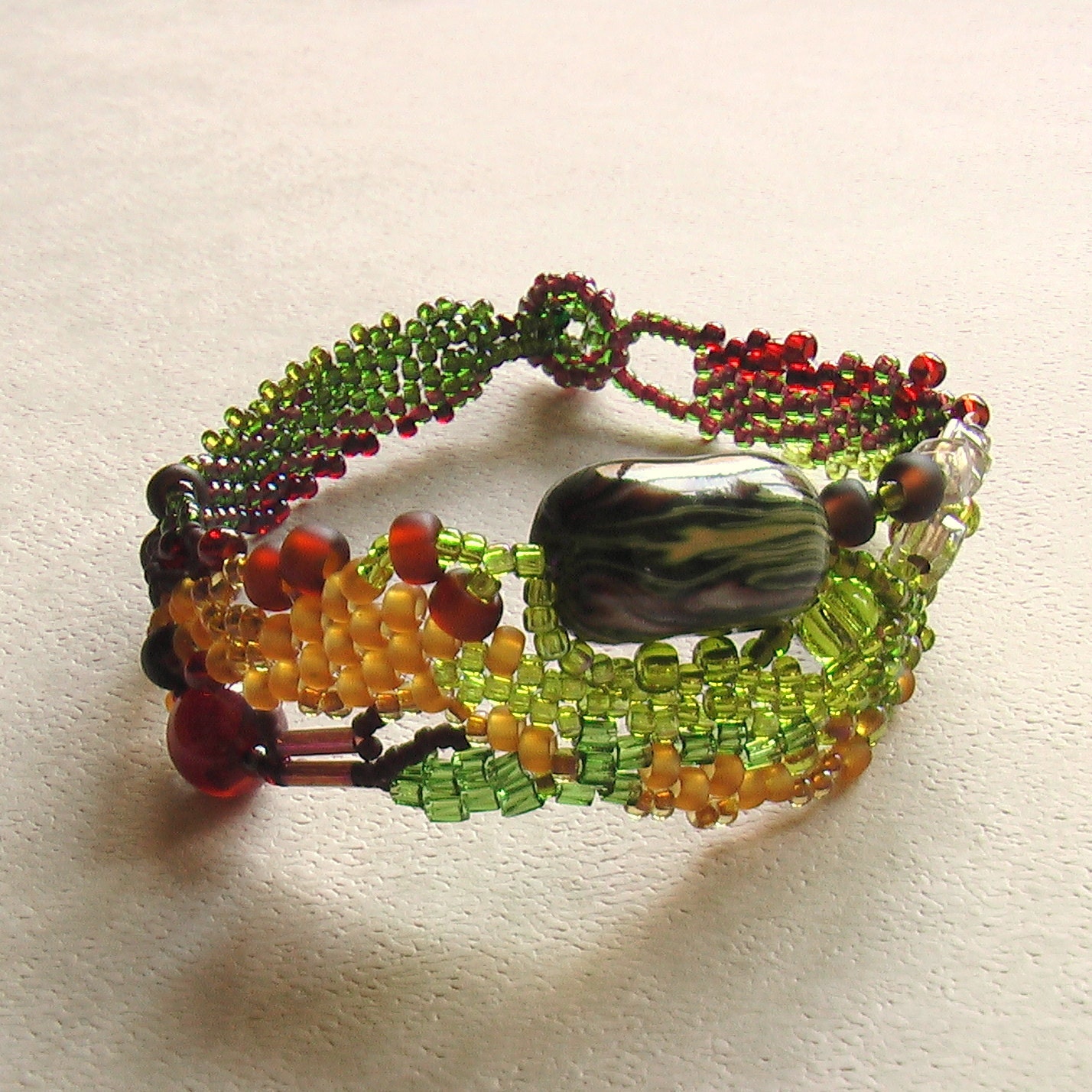 Organic free form series Seed beaded free form bracelet in shades of green and brown with agate bead and handmade polymer clay bead - Moussycrafts