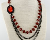Multi Strand Black Chain Necklace with Red Rondelle Faceted Beads. BRIGITTE.