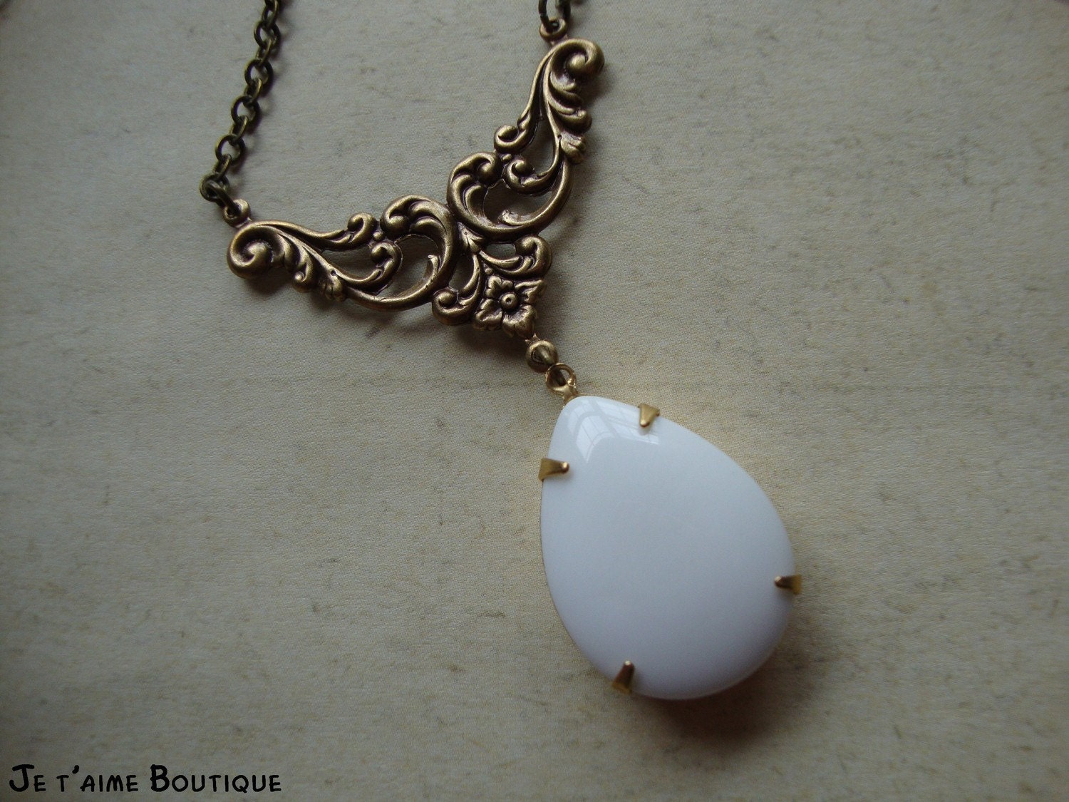 METRO CHIC - Vintage Estate Style Necklace in antiqued brass with opaque white glass jewel and swarovski crystal