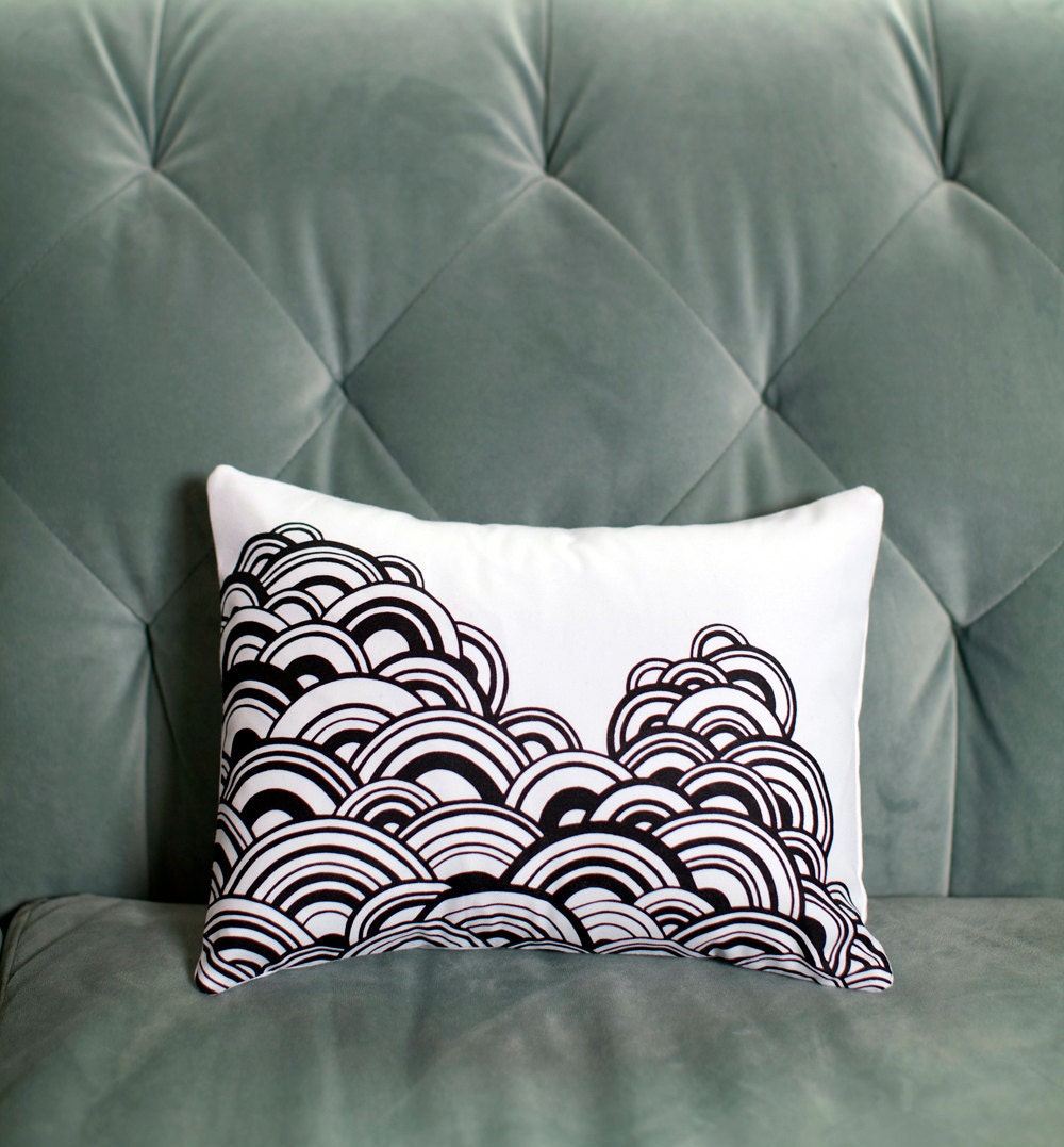 menacing clouds . organic pillow . 10 x 13 . papercut design