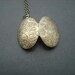 vintage two sided victorian style floral pattern oval locket - antique brass