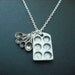 muffin pan and measuring spoon necklace