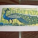 Peacock linocut print.
