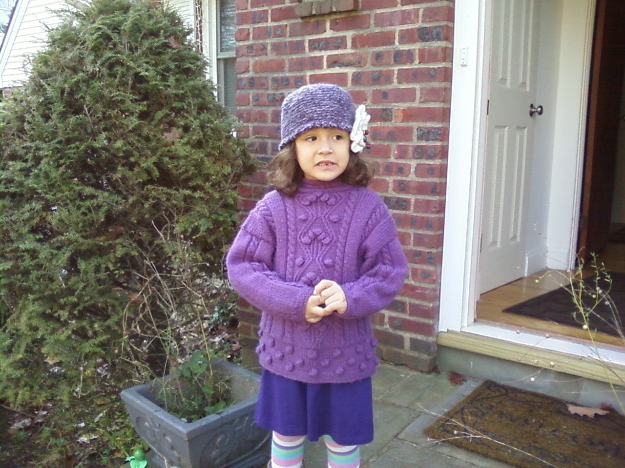 Purple Hat with a big white  flower