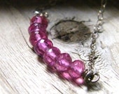 pink necklace of faceted tourmanline gemstone beads and sterling silver