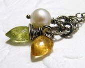 golden amber imperial topaz olive green garnet and a fresh water pearl trio sterling silver necklace