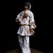 Mixed media sculpture (clay, fabric, wood).Traditional italian character - Pulcinella