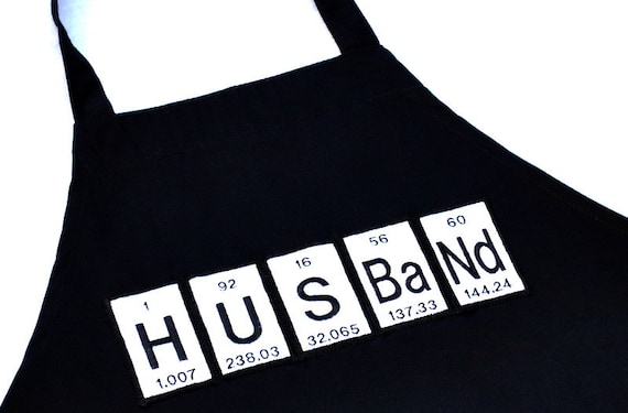 Husband Periodic Table Black Apron from Yellow Bug Boutique Husband Periodic Table Black Apron from Yellow Bug Boutique