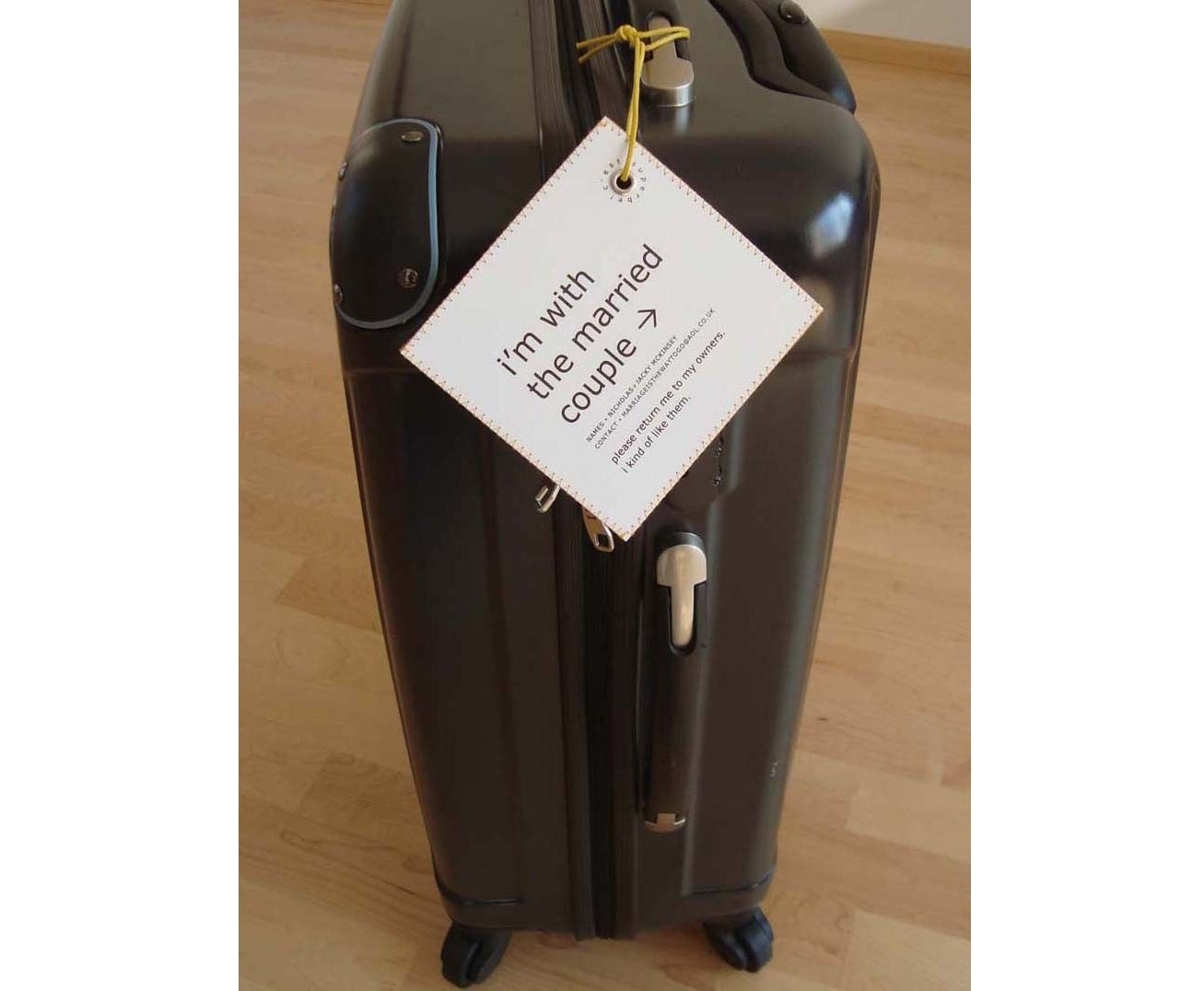 Great Unexpected Wedding Gift - Wedding Luggage Tag that's traveling with The Married Couple.