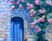 Roses Growing Over the Blue Door