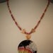 Whimsycle Capiz Shell Medallion Red And Gold Necklace with Child Blowing Bubbles