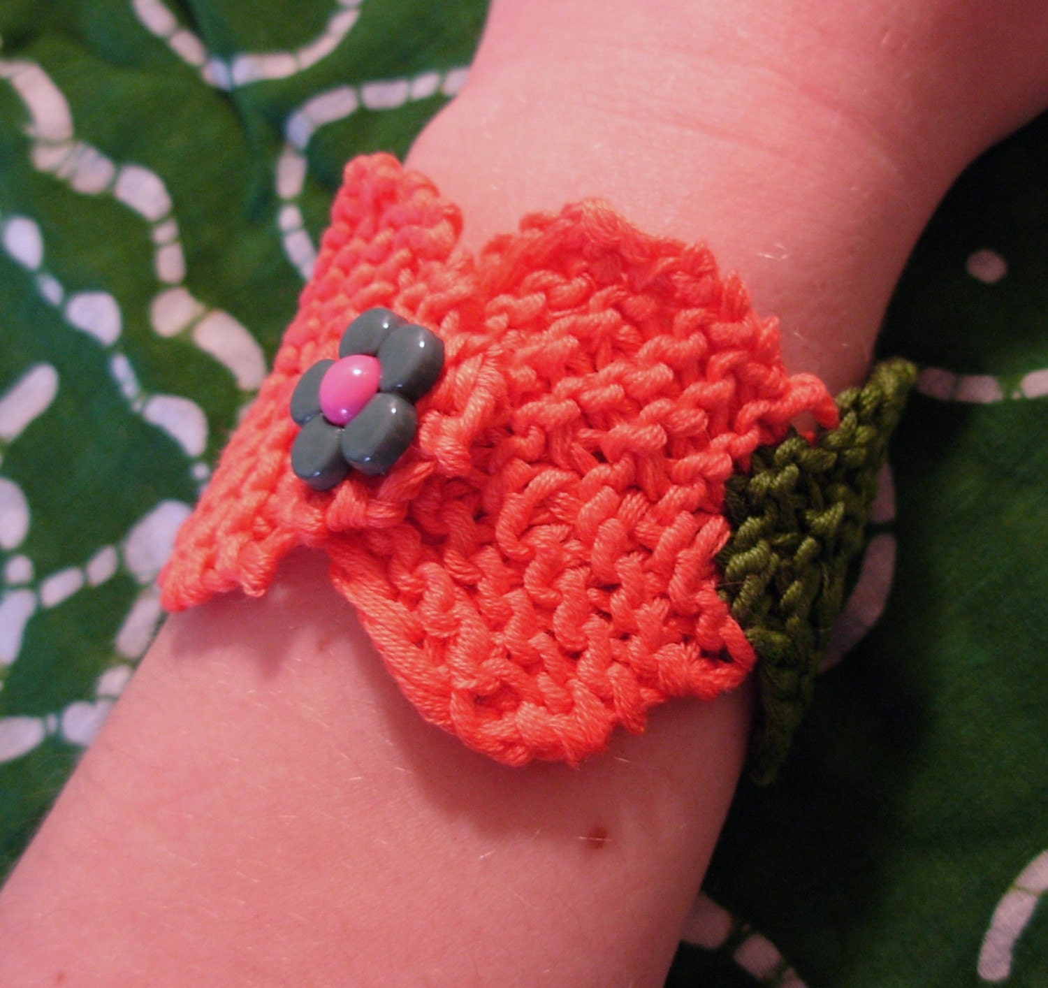 Orange and green knitted cuff bracelet