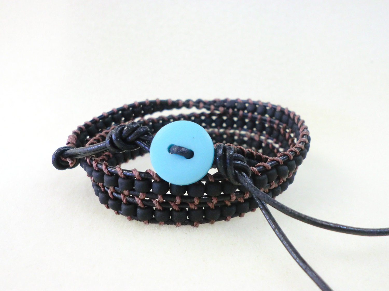 WrapLet, Unisex Matte Black on BLack with Blue button