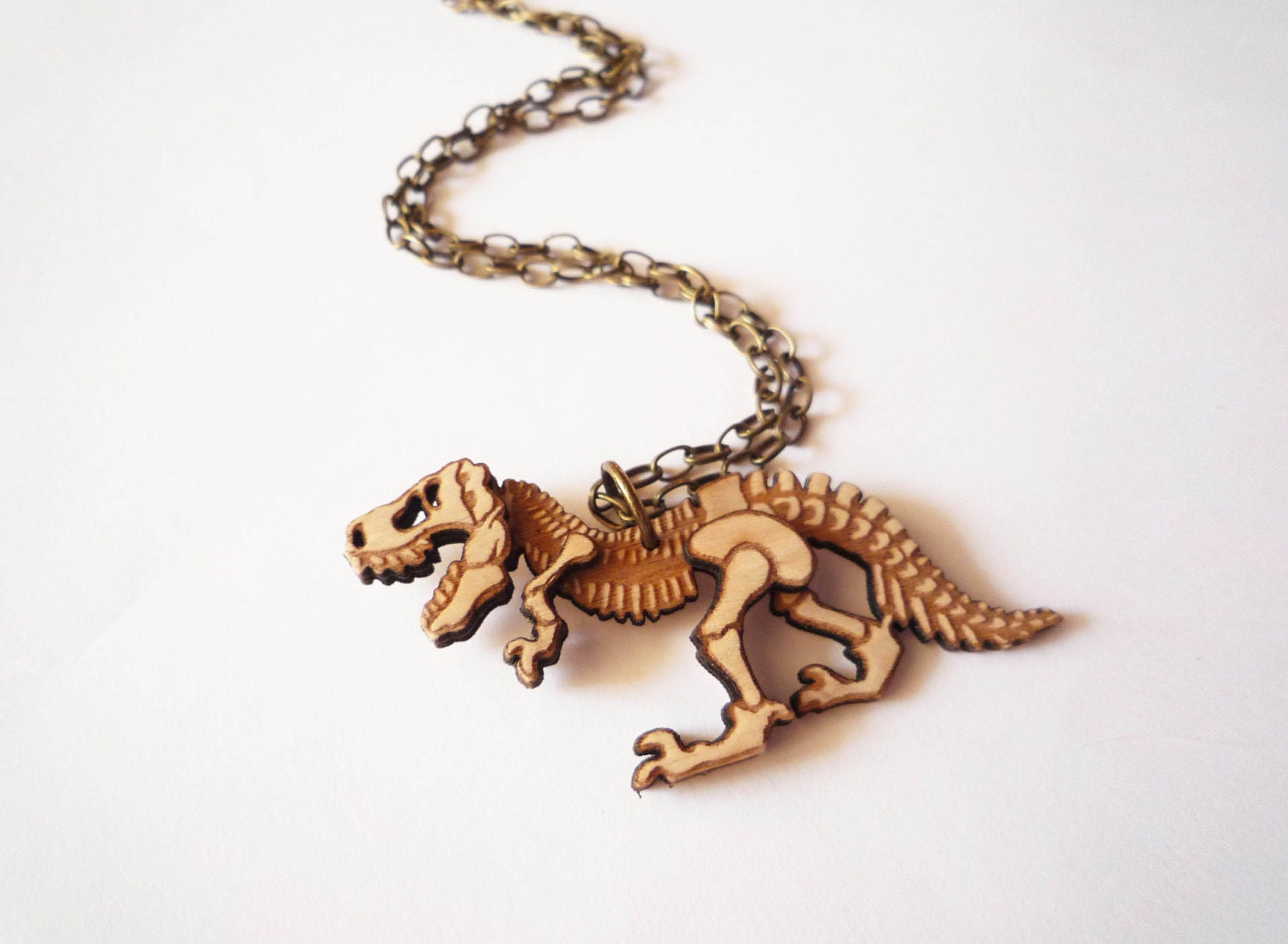 Dinosaur Necklace by Vectorcloud