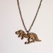 Dinosaur Necklace by Vectorcloud