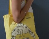 yellow cotton tote bag printed with tattooed wrestler man