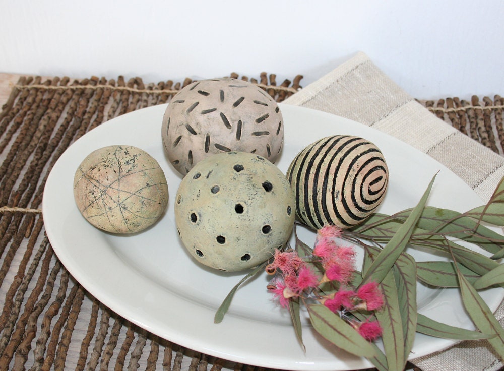 Group of four decorative ceramic spheres.