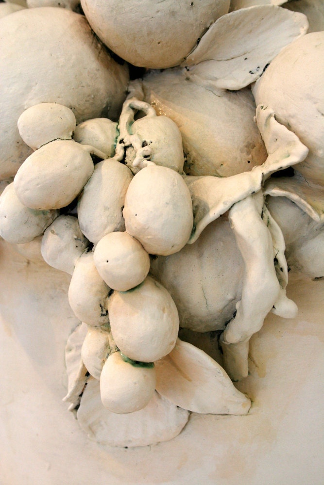 Sculptural ceramic basket of fruit