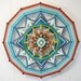 Unbroken Circle, an 24 inch, 12 sided, Ojo de Dios mandala, by Jay Mohler