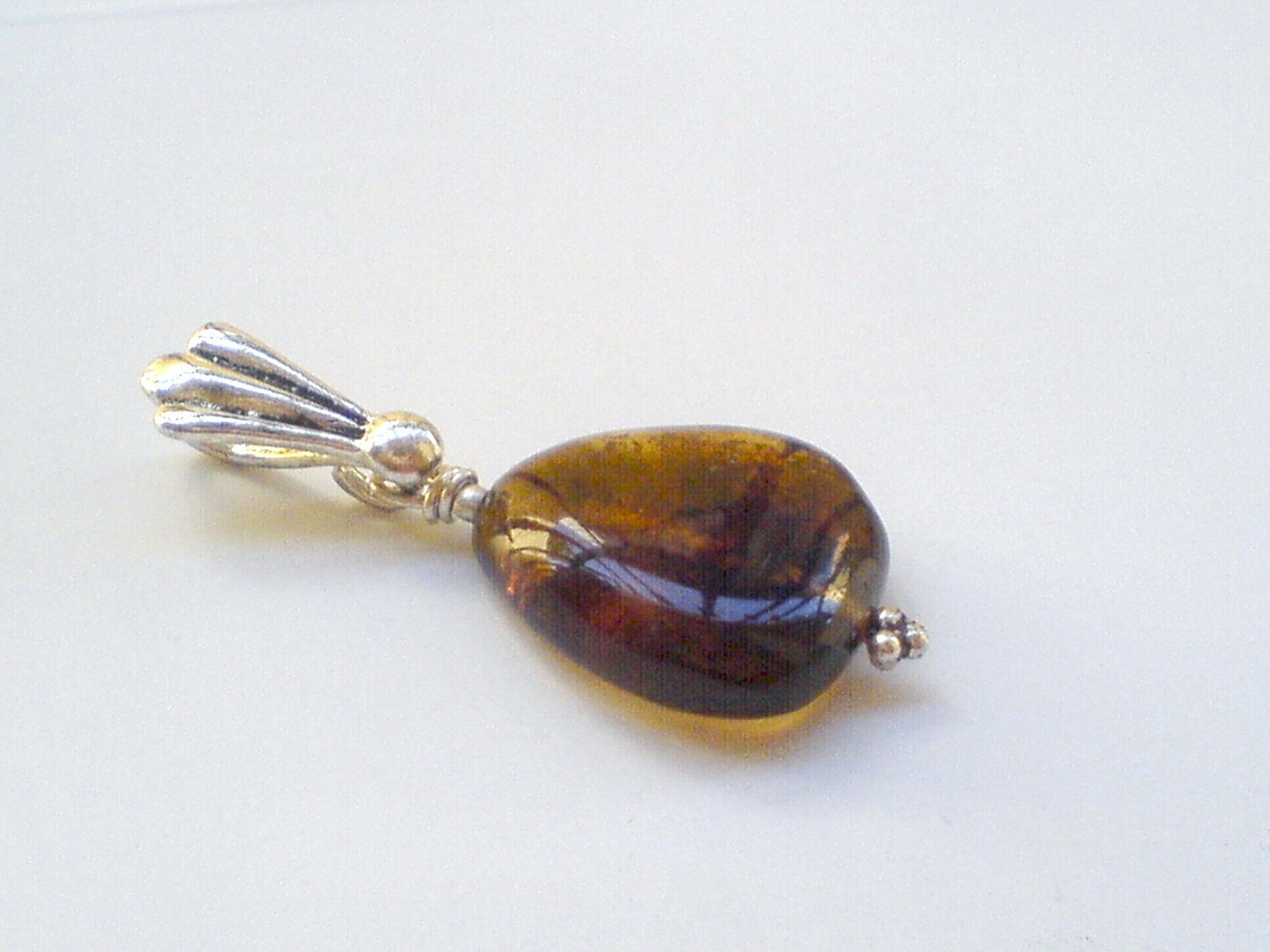 Dominican Amber Pendant with Honey Cognac colors on it - DOMINICANLOUNGE