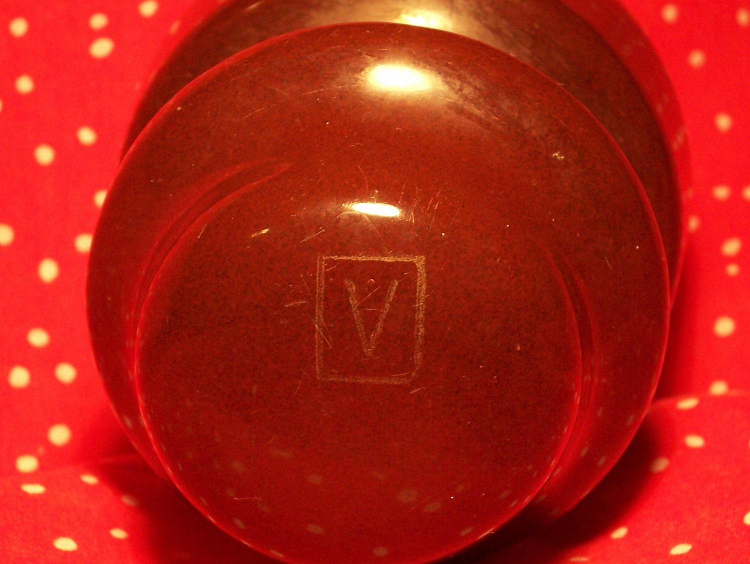 Insulator,  brown ceramic porcelain with "V" mark on top