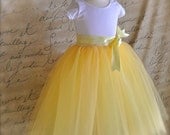 Daffodil yellow tutu for girls. Butter yellow, lemon yellow and ivory tulle is sewn. Flower Girls tutu skirt. Your choice of ribbon color.