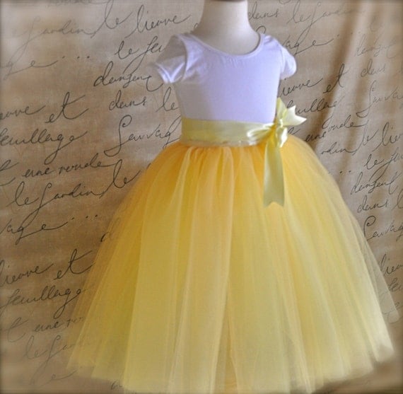 The Daffodil Tutu for Flower Girls. Six layers of butter yellow, lemon yellow and ivory tulle is sewn.